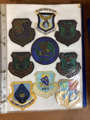 Lot 765 - Three albums of American Air Force military cloth badges to include rank insignia (3 albums)