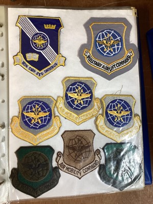 Lot 765 - Three albums of American Air Force military cloth badges to include rank insignia (3 albums)