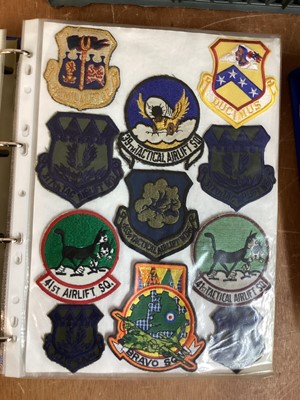 Lot 765 - Three albums of American Air Force military cloth badges to include rank insignia (3 albums)