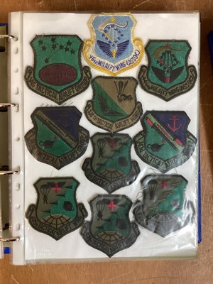Lot 765 - Three albums of American Air Force military cloth badges to include rank insignia (3 albums)