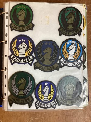 Lot 765 - Three albums of American Air Force military cloth badges to include rank insignia (3 albums)