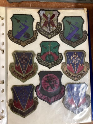 Lot 765 - Three albums of American Air Force military cloth badges to include rank insignia (3 albums)