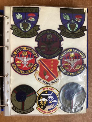 Lot 765 - Three albums of American Air Force military cloth badges to include rank insignia (3 albums)