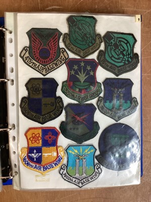 Lot 765 - Three albums of American Air Force military cloth badges to include rank insignia (3 albums)