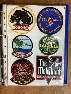 Lot 765 - Three albums of American Air Force military cloth badges to include rank insignia (3 albums)