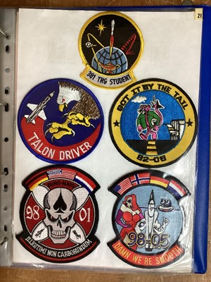 Lot 765 - Three albums of American Air Force military cloth badges to include rank insignia (3 albums)