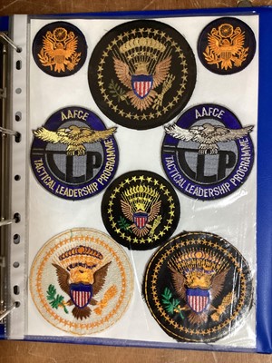 Lot 765 - Three albums of American Air Force military cloth badges to include rank insignia (3 albums)