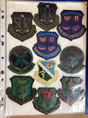 Lot 765 - Three albums of American Air Force military cloth badges to include rank insignia (3 albums)