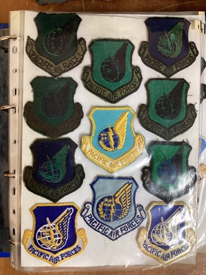 Lot 765 - Three albums of American Air Force military cloth badges to include rank insignia (3 albums)