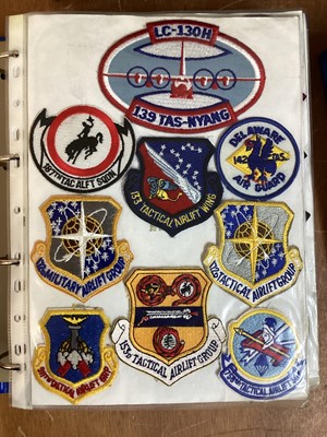 Lot 765 - Three albums of American Air Force military cloth badges to include rank insignia (3 albums)