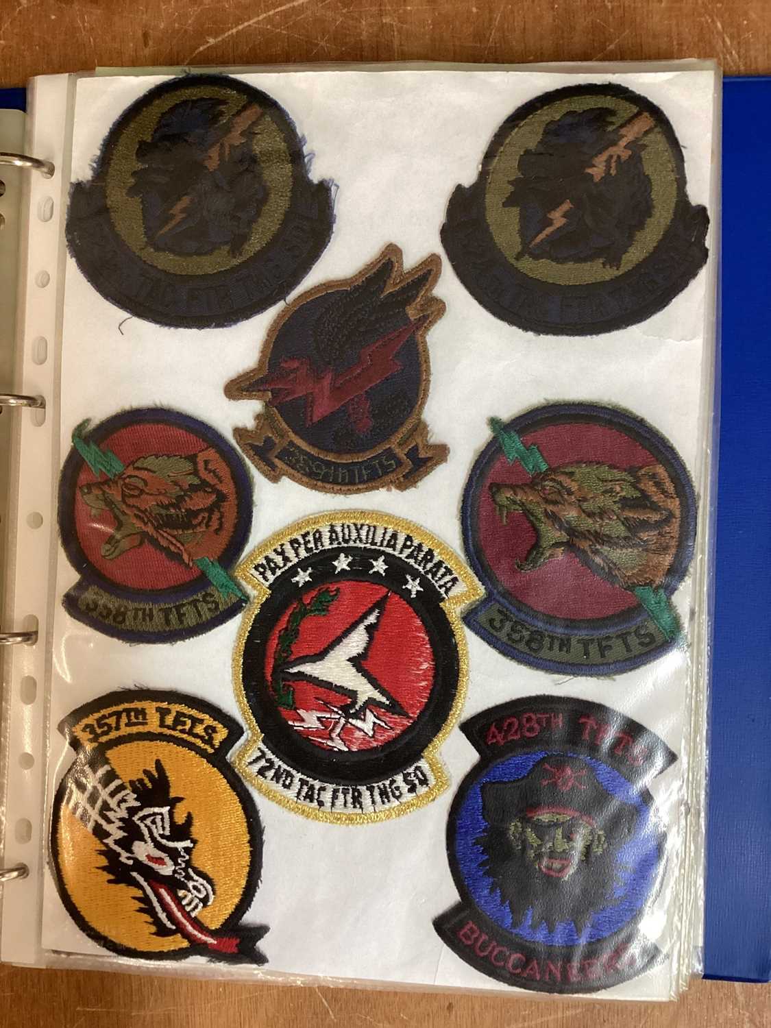 Lot 766 - Four albums of American Air Force military cloth badges to include rank insignia (4 albums)