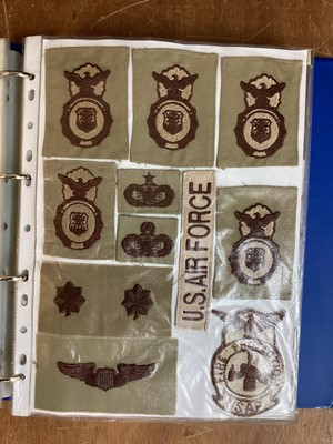 Lot 766 - Four albums of American Air Force military cloth badges to include rank insignia (4 albums)