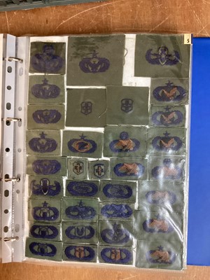 Lot 766 - Four albums of American Air Force military cloth badges to include rank insignia (4 albums)