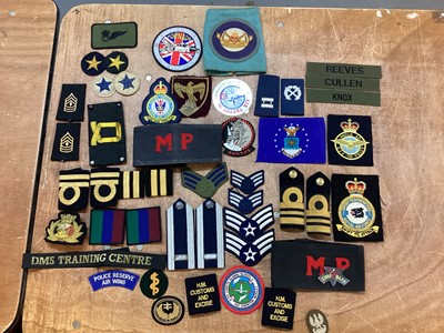 Lot 769 - Collection of cloth British and American military badges to include Navy and Air Force (1 box)