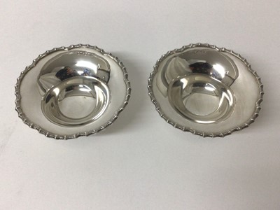 Lot 120 - Pair of silver Bon Bon dishes, Sheffield 1937 (Mappin & Webb), of round shaped form with fluted rim, stepped base, 10cm diameter