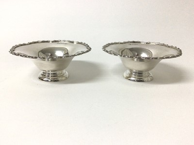 Lot 120 - Pair of silver Bon Bon dishes, Sheffield 1937 (Mappin & Webb), of round shaped form with fluted rim, stepped base, 10cm diameter
