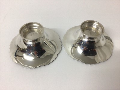 Lot 120 - Pair of silver Bon Bon dishes, Sheffield 1937 (Mappin & Webb), of round shaped form with fluted rim, stepped base, 10cm diameter