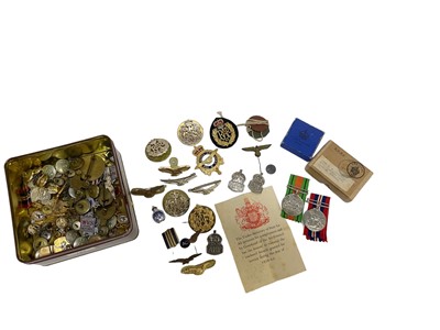 Lot 782 - Second World War Nazi uniform eagle and swastika pin, together with silver A.R.P badges and various other buttons and badges (1 box)