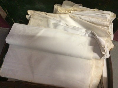 Lot 2145 - Large quantity of white damask table clothes and napkins in a leather suitcase and box.