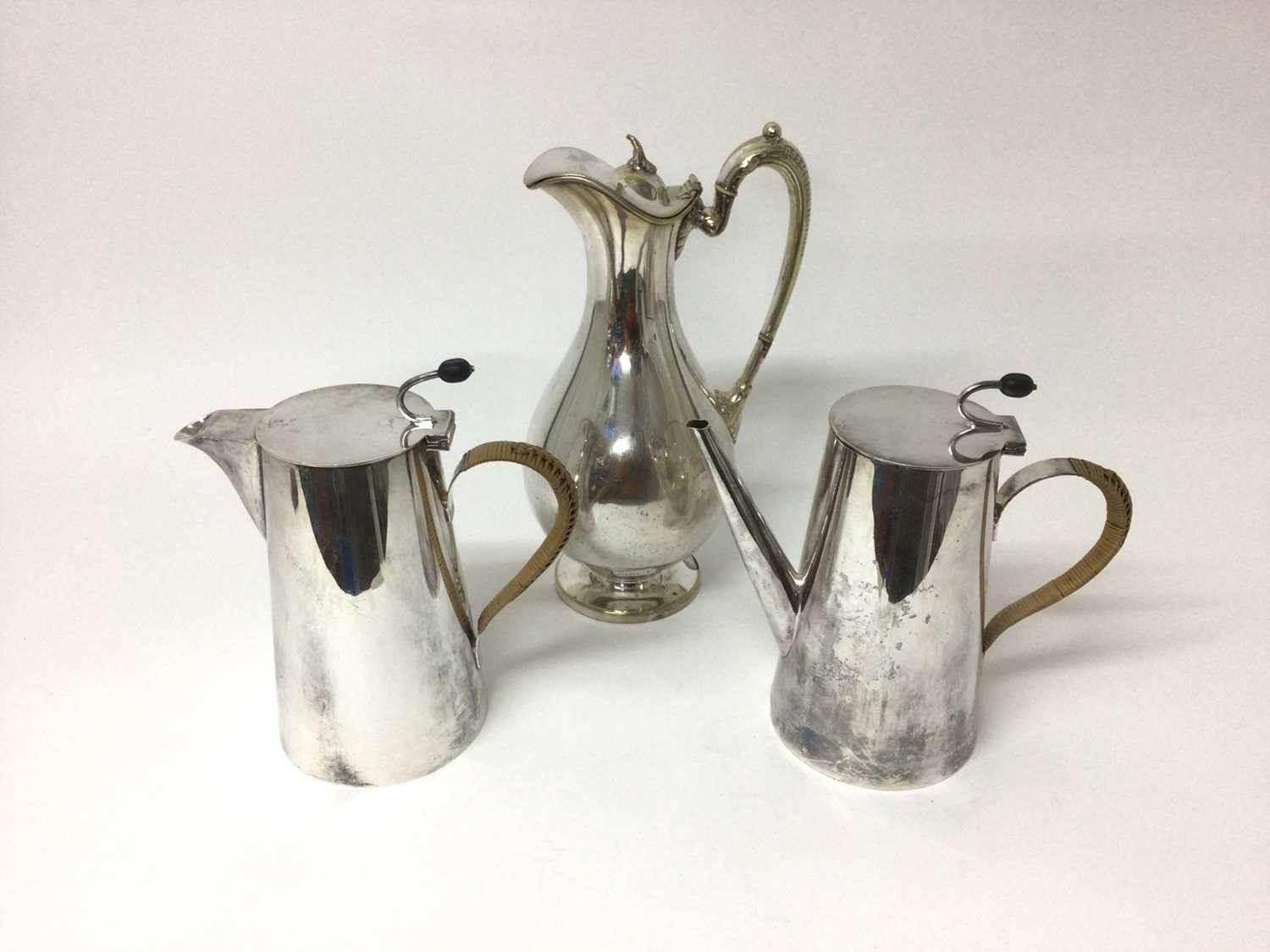 Lot 101 - Asprey silver plated coffee pot and matching hot water pot with rattan covered handles and coffee bean formed handles, 21cm high, together with a silver plated water pitcher (3)