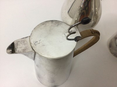 Lot 101 - Asprey silver plated coffee pot and matching hot water pot with rattan covered handles and coffee bean formed handles, 21cm high, together with a silver plated water pitcher (3)