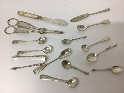 Lot 104 - Mixed group of Georgian and later silver condiment spoons, sugar tongs, plated grape scissors and other items, weighable silver 3.6ozs