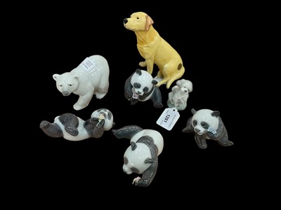 Lot 1281 - Four Lladro Pandas together with a Polar Bear and a Dog, plus a Beswick Labrador, all boxed (7)