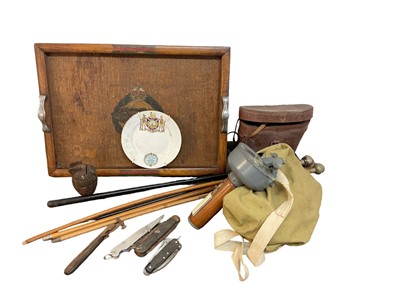 Lot 814 - Second World War gas mask in canvas bag, together with grenade money box, swagger sticks, military knives and sundry militaria (1 box).