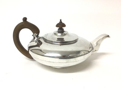 Lot 97 - 1920s silver teapot of squat melon form, with fruitwood handle and knop (London 1921), all at 19ozs