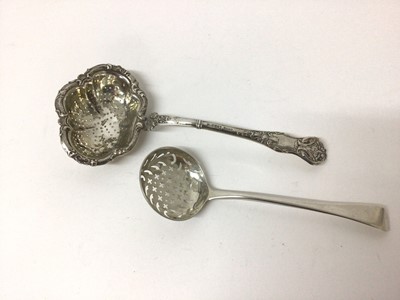 Lot 99 - Russian silver (84) sifter spoon with shaped bowl, together with a George III silver sifter spoon (2)