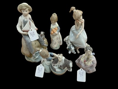 Lot 1284 - Five Lladro figures including seated girl on telephone, boy with boat and girl washing dog