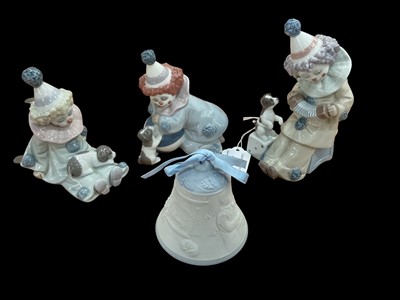 Lot 1286 - Three small Lladro porcelain clowns and a Lladro bell (4)