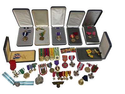 Lot 839 - American Purple Heart medal in box, together with various other boxed American medals and assorted European medals and decorations, cloth badges and other militaria (1 box).