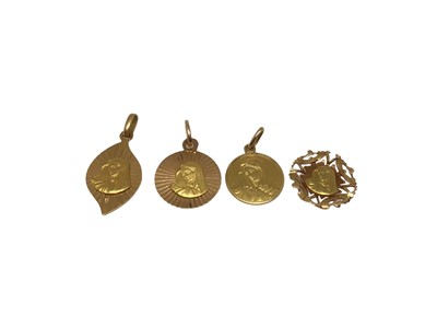 Lot 165 - Four 18ct gold religious pendants depicting the Virgin Mary