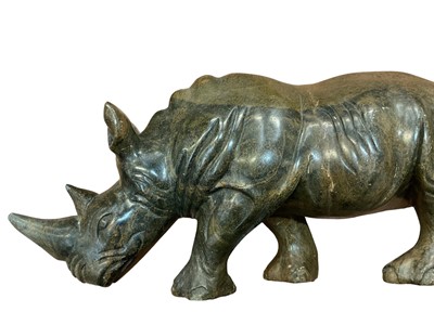 Lot 18 - Nigerian greenstone carving of a rhinoceros and a similar bust