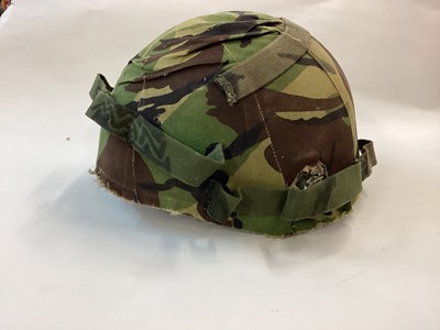 Lot 850 - Rare experimental British Northern Ireland Pattern Combat Helmet c. 1978 complete with liner, camouflage cover and PVC cheek pieces.  Made by Thetford Moulded Products, Norfolk, England