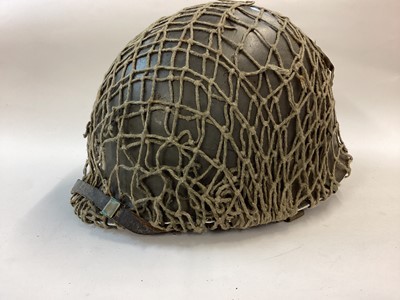 Lot 865 - Rare M75 Austrian Cold War era M1style helmet pattern M58, complete with liner dated1971, helmet chinstrap, liner chinstrap and correct original net.  Excellent paint finish