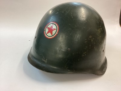 Lot 870 - M50 Hungarian steel helmet of Soviet style, early Cold War era with first type cradle, complete with chinstrap and red emblem on front