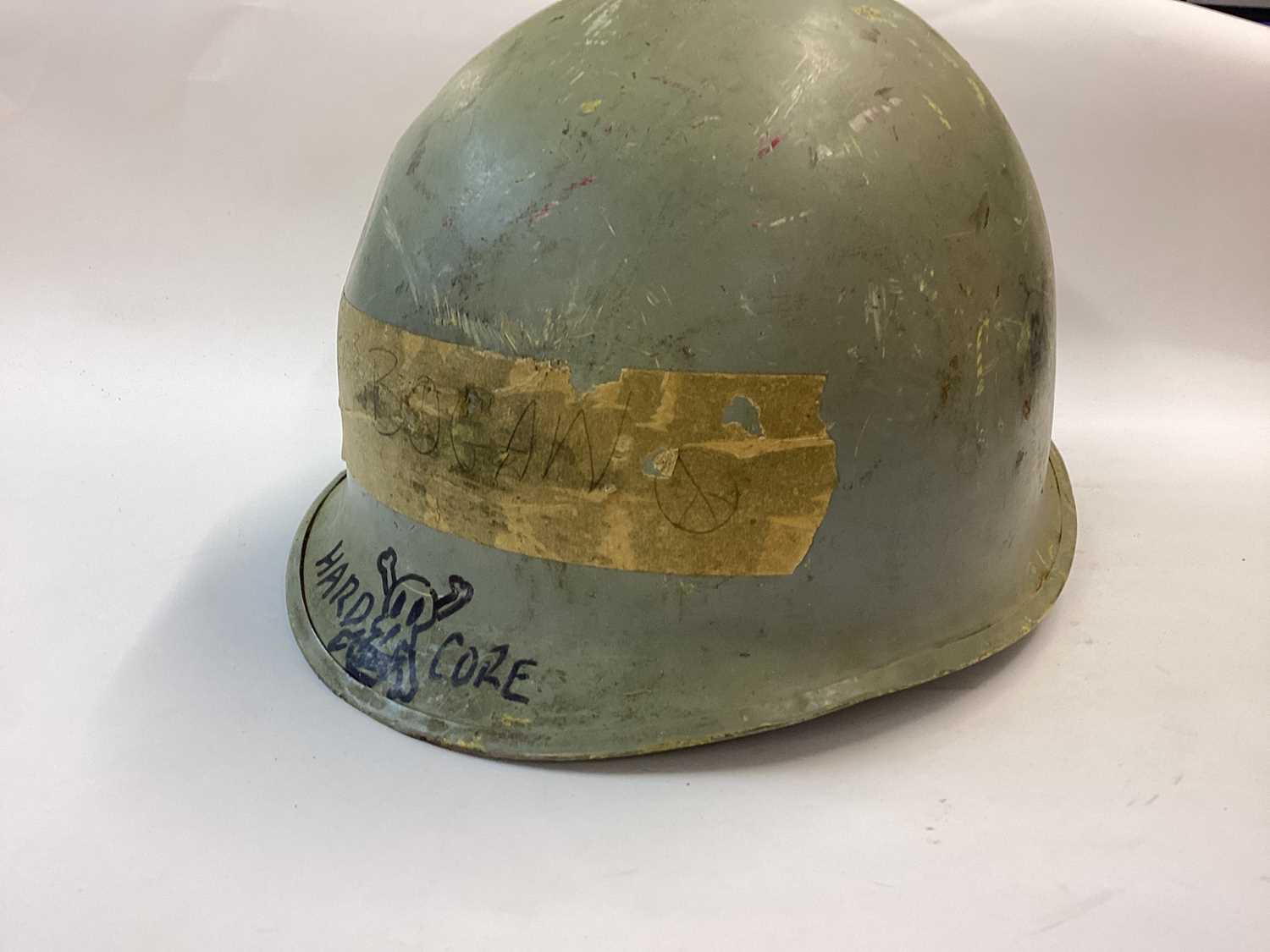 Lot 880 - US Navy M1 steel helmet complete with plastic liner dated 1972.  The helmet body is WW2 front seam c. 1943 -1944 and painted blue/grey with rank marking for Fire Controlman Petty Officer 3rd Class....