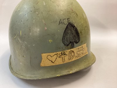 Lot 880 - US Navy M1 steel helmet complete with plastic liner dated 1972.  The helmet body is WW2 front seam c. 1943 -1944 and painted blue/grey with rank marking for Fire Controlman Petty Officer 3rd Class....