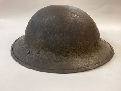 Lot 883 - British-made WW1 War Office Pattern steel helmet used by the US Army 1917-1918, stamped FS157.  Bearing formation sign of 25th Infrantry Division (Yankee Division) with field finish.  Complete with...