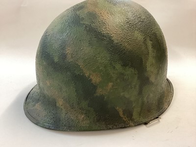 Lot 884 - US M1 steel helmet body with camouflage paint finish, front seam c. 1943 - 1944, factory cork finish present underneath camouflage paint.  Lot and lift number 93A (believed McCord).  Excellent cond...