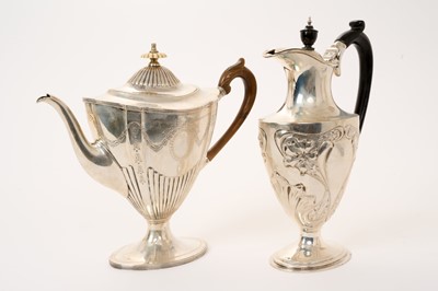 Lot 306 - Victorian silver coffee pot and an Edwardian Art Nouveau silver hot water jug (2)