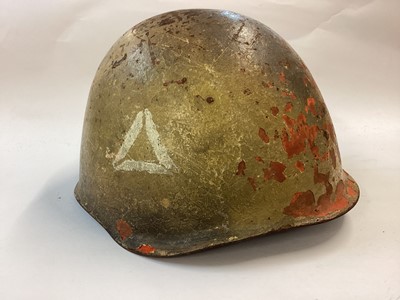 Lot 885 - Polish Wz50 Soviet style steel helmet of the early Cold War era, believed used in Suez 1956 and the Arab-Israeli Wars 1967 and 1973.  Complete with desert camouflage paint, liner and chinstrap.  Fo...