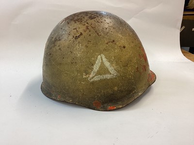 Lot 885 - Polish Wz50 Soviet style steel helmet of the early Cold War era, believed used in Suez 1956 and the Arab-Israeli Wars 1967 and 1973.  Complete with desert camouflage paint, liner and chinstrap.  Fo...