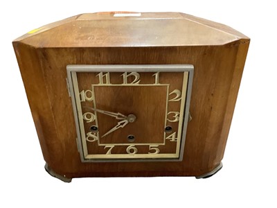 Lot 2608 - A very large glass bottle in a basket and three early 20th century mantel clocks