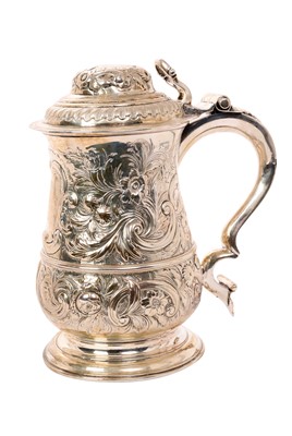 Lot 308 - George III silver lidded tankard with later repoussé decoration