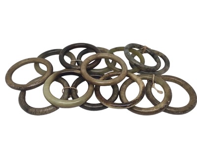 Lot 211 - Fourteen green/ brown hard stone polished bangles, all approximately 8cm diameter