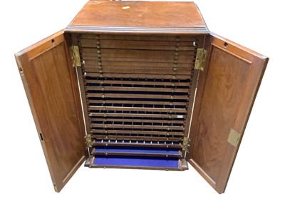 Lot 2633 - Victorian walnut collector's cabinet with narrow drawers for coins or microscope slides, enclosed by two panel doors, brass side handles, 39cm wide x 27.5cm deep x 55.5cm high