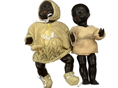 Lot 1772 - Three black dolls including pedigree. With clothing.